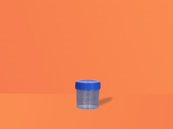 Urine container by Mono Industries placed on a table. Available in sizes 30ml, 50ml and 100ml
